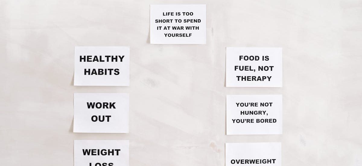 Minimalist display of motivational health and wellness quotes emphasizing healthy habits and weight management.
