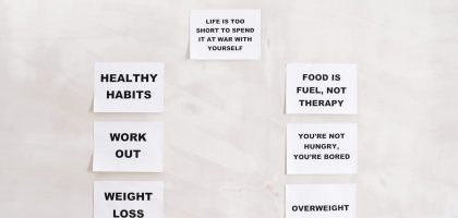 Minimalist display of motivational health and wellness quotes emphasizing healthy habits and weight management.